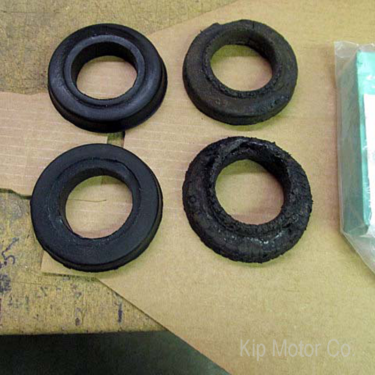 New rubber gaskets on left; original on right